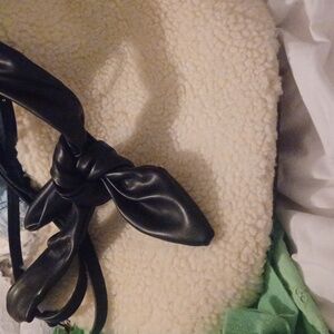 WHO WHAT WEAR crossbody Faux Sherpa front, black smooth leather-like tie, bucket